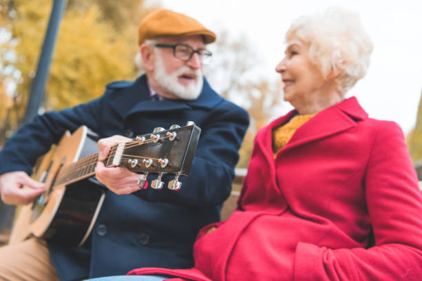 istock senior couple playing on guitar 882280030