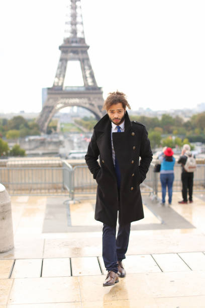 istock male model smiling near Eiffel Tower 882284770