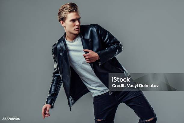 Handsome Man On Grey Background Stock Photo - Download Image Now - Men, Fashion, Fashion Model