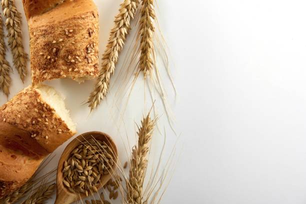 istock Assortment of fresh bread isolated on white 882292234