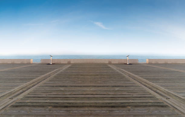istock Empty wooden floor at ocean skyline 882299722