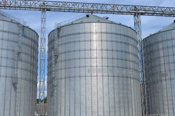 istock Agricultural Silos. Metal grain facility with silos. 882303550
