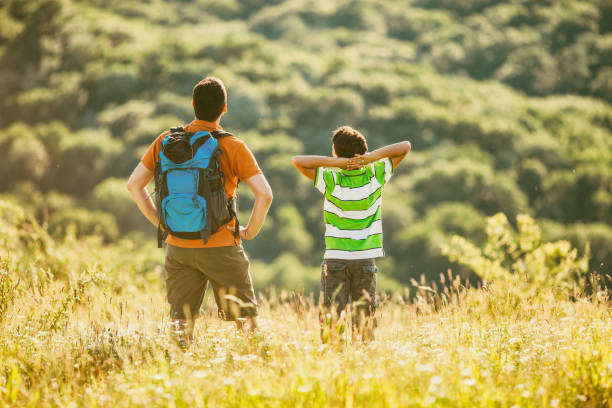 istock Father and son in nature 882306550