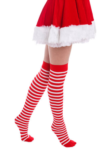 istock Legs of a girl doing steps on socks on a white isolated background 882311662