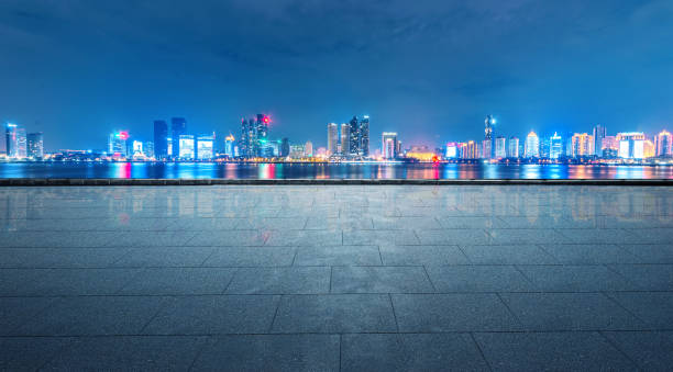 istock Panoramic skyline and buildings with empty concrete square floor 882313804