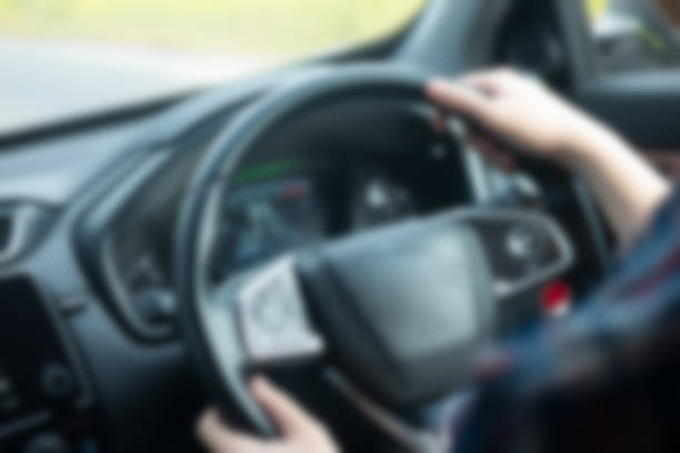 istock Blur background holding steering wheel car for driving 882314950