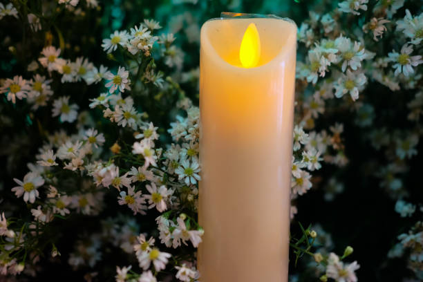 istock White burning advent candles for decorations  with white flower 882315150