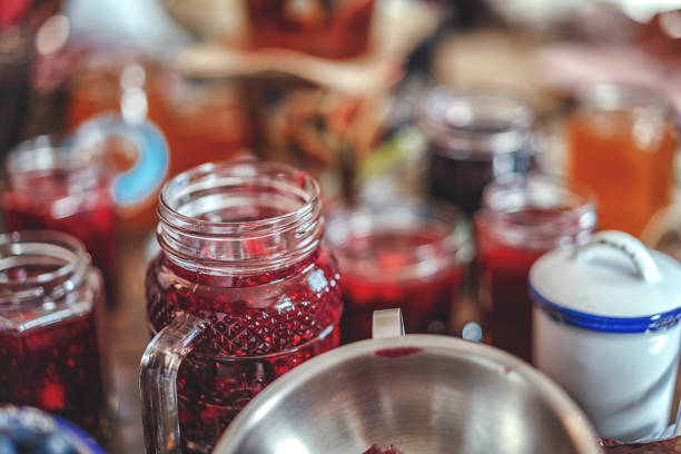 istock Preparing Homemade Strawberry, Blueberry and Raspberry Jam and Canning in Jars 882315548