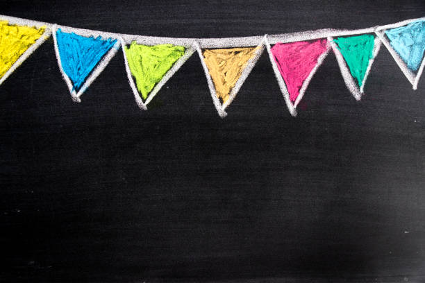 Colorful chalk drawing in hanging party flag shape on blackboard background