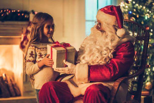 istock Girl with Santa Claus. 882323118