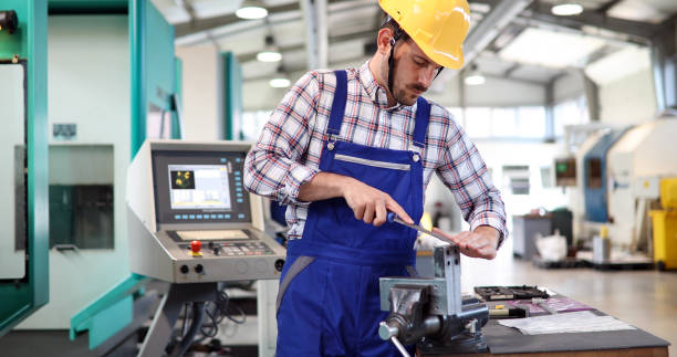 istock Male worker and quality control inspection in factory 882323136