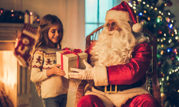 istock Girl with Santa Claus. 882323164
