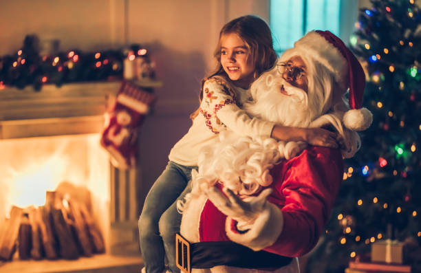 istock Girl with Santa Claus. 882323500