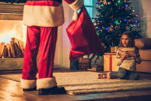 istock Girl with Santa Claus. 882323536
