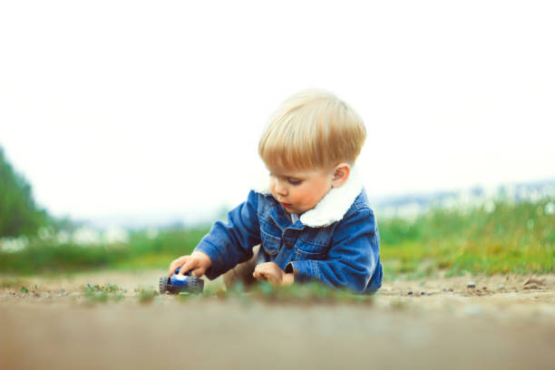 istock a boy plays in the sand 882326762