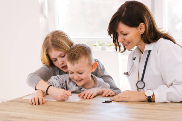 istock Funny kids in doctor's office 882333790