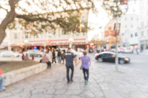 istock Blurred people walking at Alamo Square in Downtown San Antonio 882334488