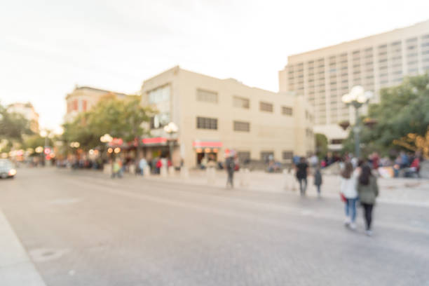 istock Blurred people walking at Alamo Square in Downtown San Antonio 882334538