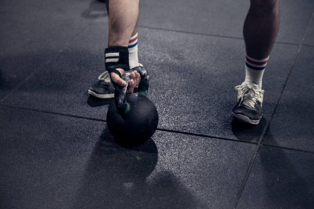 istock Kettlebell - athlete who with kettlebell 882337642
