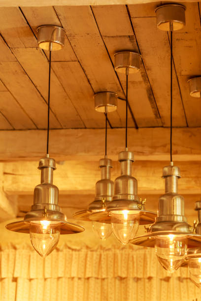 istock Warm lighting modern ceiling lamps in the cafe and interior decoration restaurant 882341274