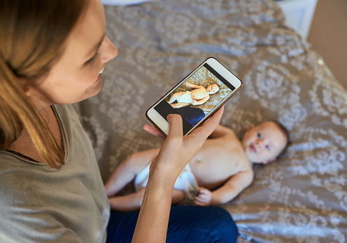 Shot of a young mother and her baby at home