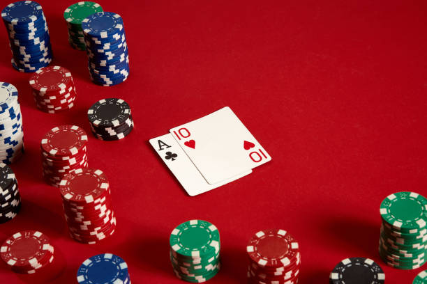 istock Poker cards and gambling chips on red background 882353714