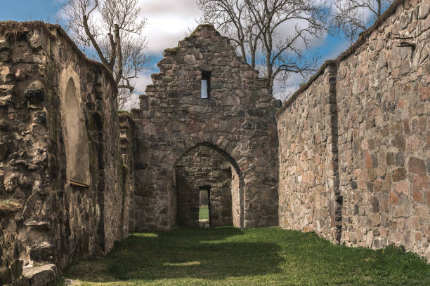 istock Medieval church ruin in spring sunlight 882355188