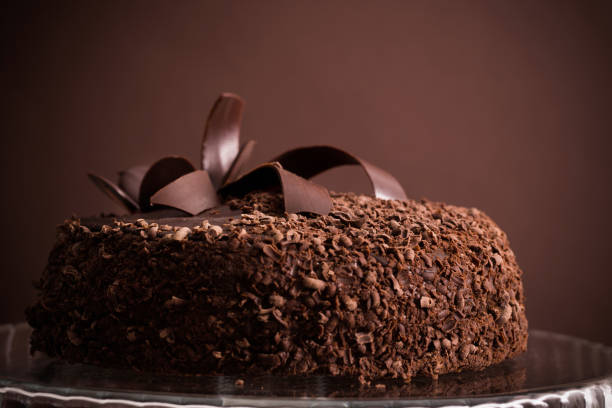 istock Chocolate cake on old wooden table 882357818