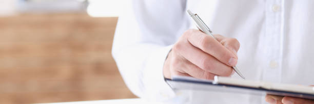 istock Male medicine doctor hand holding silver 882358018