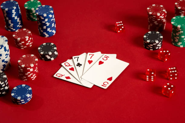 istock Poker cards and gambling chips on red background 882358756