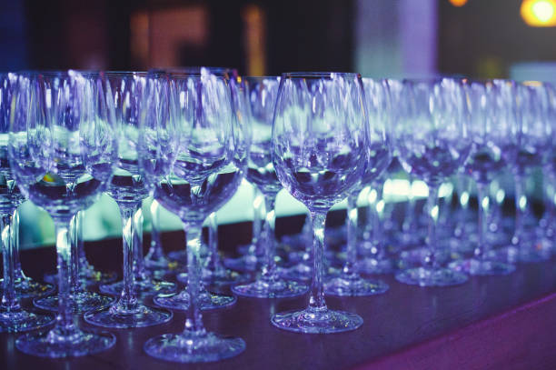istock wine glasses in scenic light, preparation for a banquet 882367264