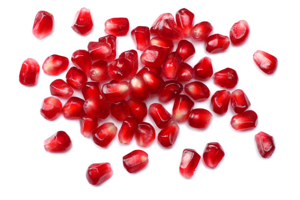 istock pomegranate seeds isolated on white background. top view. pomegranate berries. 882368362