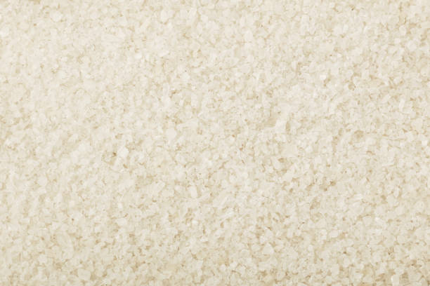 istock Close up background of white sea salt 882372926