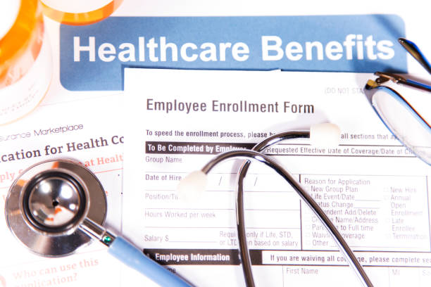 istock Open enrollment healthcare benefit forms. 882373538