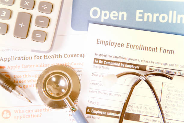istock Open enrollment healthcare benefit forms. 882373596