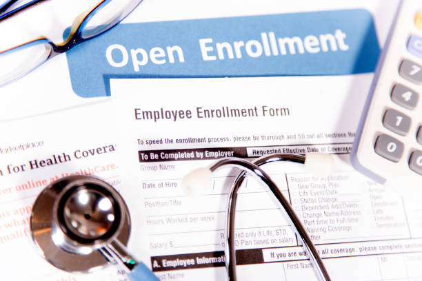 istock Open enrollment healthcare benefit forms. 882373766