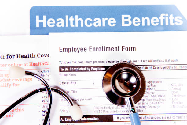 istock Open enrollment healthcare benefit forms. 882373892