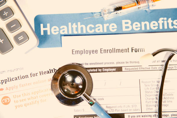 istock Open enrollment healthcare benefit forms. 882373994