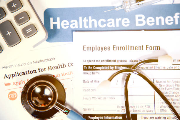 istock Open enrollment healthcare benefit forms. 882378376