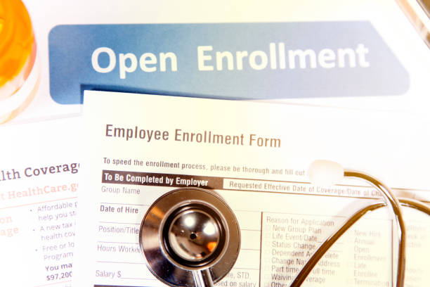 istock Open enrollment healthcare benefit forms. 882378582