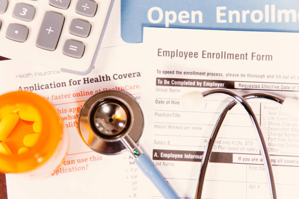 istock Open enrollment healthcare benefit forms. 882378898