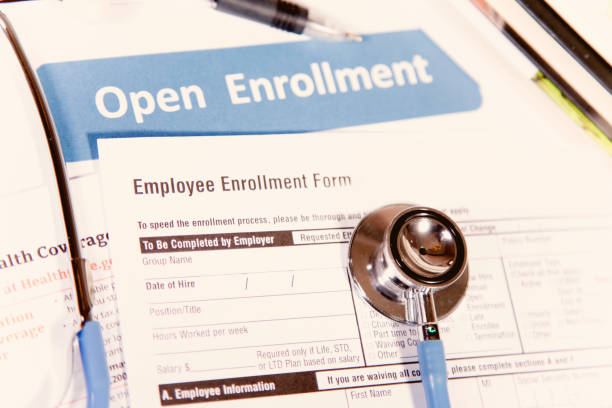 istock Open enrollment healthcare benefit forms. 882379088