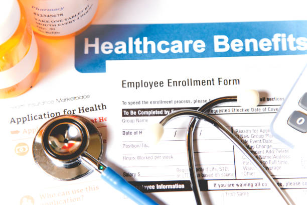 Open enrollment healthcare benefit forms. stock photo