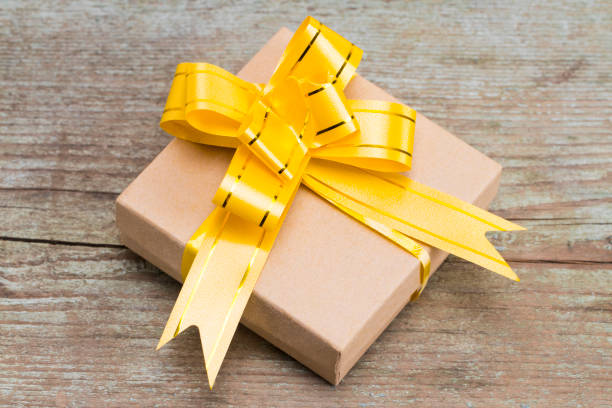 istock Gift box on wooden background, top view 882381752