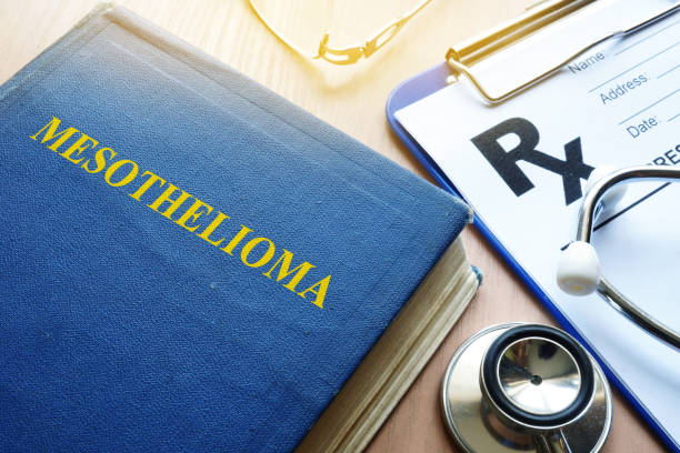 istock Book about Mesothelioma and stethoscope on a table. 882384786