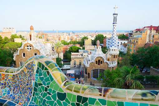 Gaudi mosaic bench and cityscape of Barcelona from park Guell, famous view of Barcelona, Spain