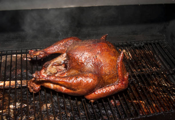 istock Smoked turkey in a wood smoker 882394754