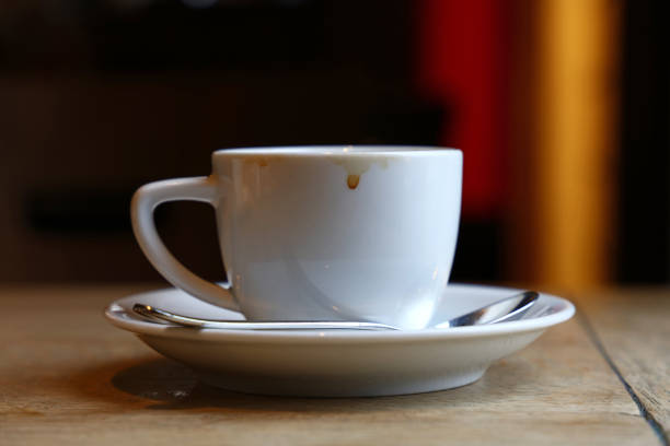 istock Close up white cup of black coffee on table 882404940