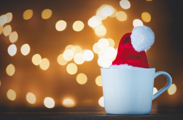 istock White cup of tea or coffee and Christmas Lights 882405136