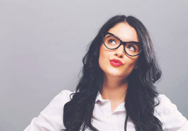 istock Young businesswoman in a thoughtful pose 882405750